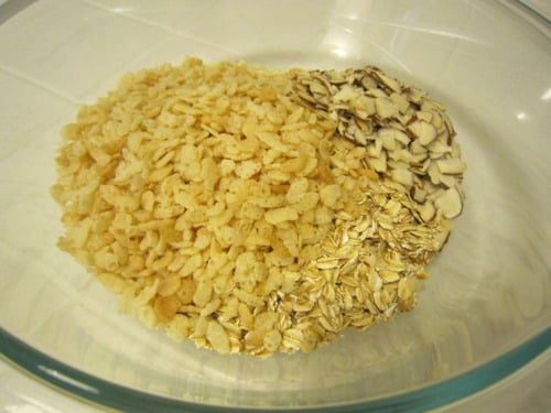 oats, rice cereal and almonds in a large bowl ready to combine