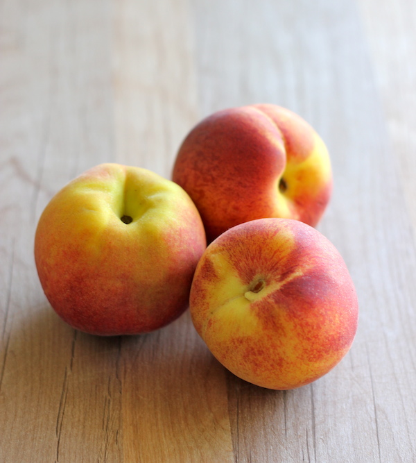 Peach Oatmeal Muffins - Wonderfully light and healthy, these cinnamon sugar crusted muffins are the perfect start to your mornings!