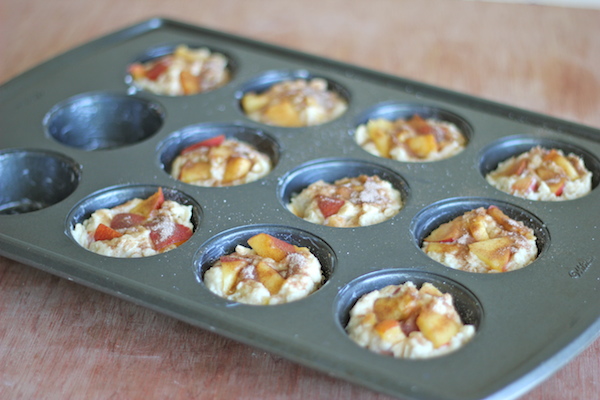 Peach Oatmeal Muffins - Wonderfully light and healthy, these cinnamon sugar crusted muffins are the perfect start to your mornings!