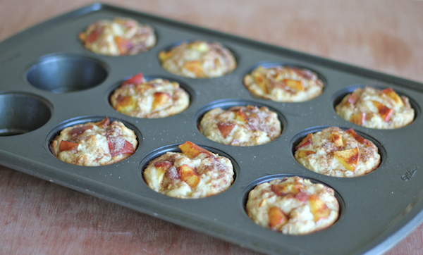 Peach Oatmeal Muffins - Wonderfully light and healthy, these cinnamon sugar crusted muffins are the perfect start to your mornings!