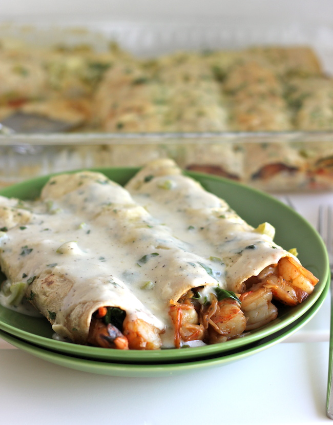 Roasted Shrimp Enchiladas with Jalapeño Cream Sauce - Smothered in a rich, jalapeño cream sauce, how can you resist?!