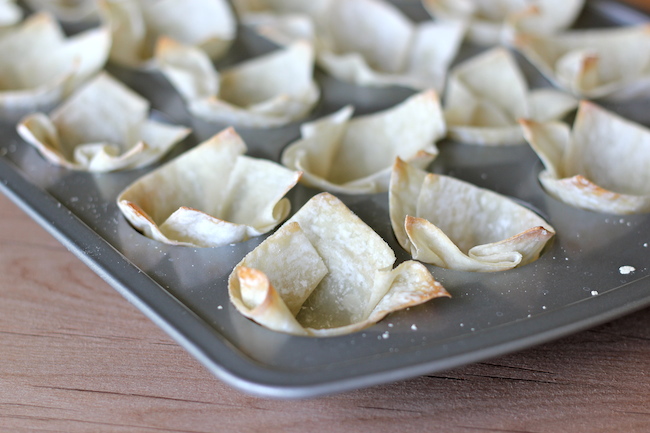 Buffalo Chicken Cups - Crisp oven-baked wonton cups loaded with buffalo chicken and blue cheese!