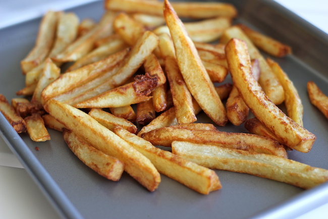 Garlic Cheese Fries - Perfectly double-fried french fries smothered in a garlic cheese sauce that can be made in 5 minutes!