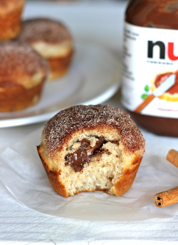 Nutella Stuffed Cinnamon Sugar Muffins - Cinnamon sugar crusted muffin tops with a hidden Nutella filling that everyone will love!