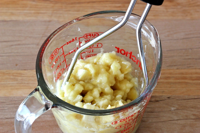 Banana Bread Kit Kat Muffins - The perfect way to use up those lingering bananas for an indulgent breakfast muffin!