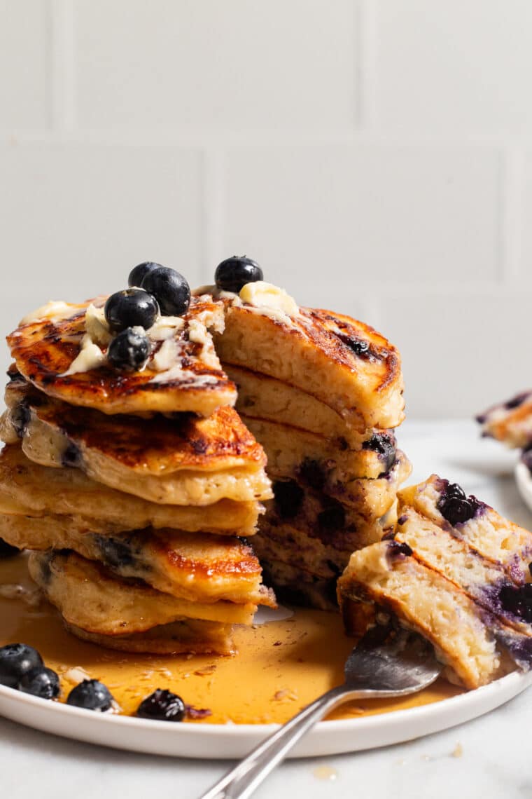 Blueberry Oatmeal Yogurt Pancakes - Start your mornings off right with these light, fluffy protein-packed pancakes, loaded with juicy blueberries. And they are freezer-friendly!
