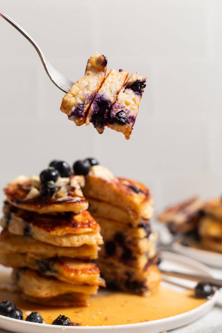 Blueberry Oatmeal Yogurt Pancakes - Start your mornings off right with these light, fluffy protein-packed pancakes, loaded with juicy blueberries. And they are freezer-friendly!