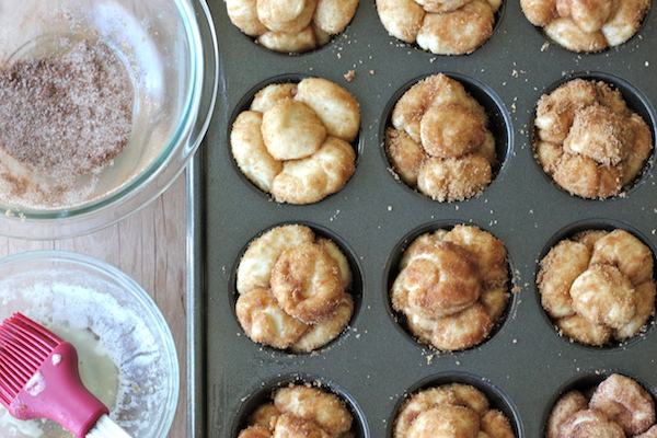 Monkey Bread Cupcakes - Classic monkey bread in irresistible cupcake form oozing with cinnamon sugar goodness and a dripping vanilla glaze!