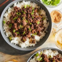 Korean beef bowl served with white rice and sesame seeds
