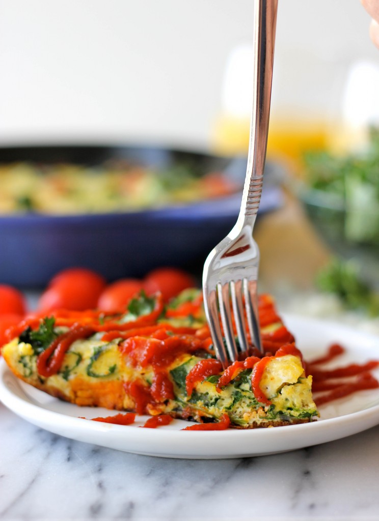 Sweet Potato Kale Frittata - Loaded with caramelized onions, tomatoes, kale and sweet potato goodness topped with melted mozzarella!