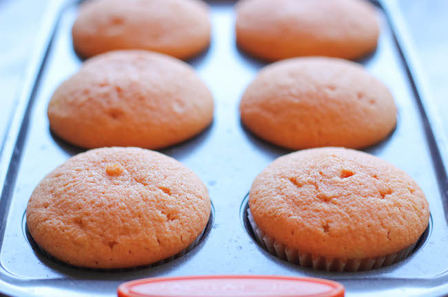 Candy Corn Cupcakes - These simple vanilla cupcakes can easily be dressed up to resemble the layers of candy corn goodness!