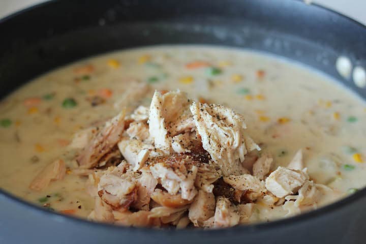 Leftover turkey pieces added to the Thanksgiving Turkey Pot Pie filling.