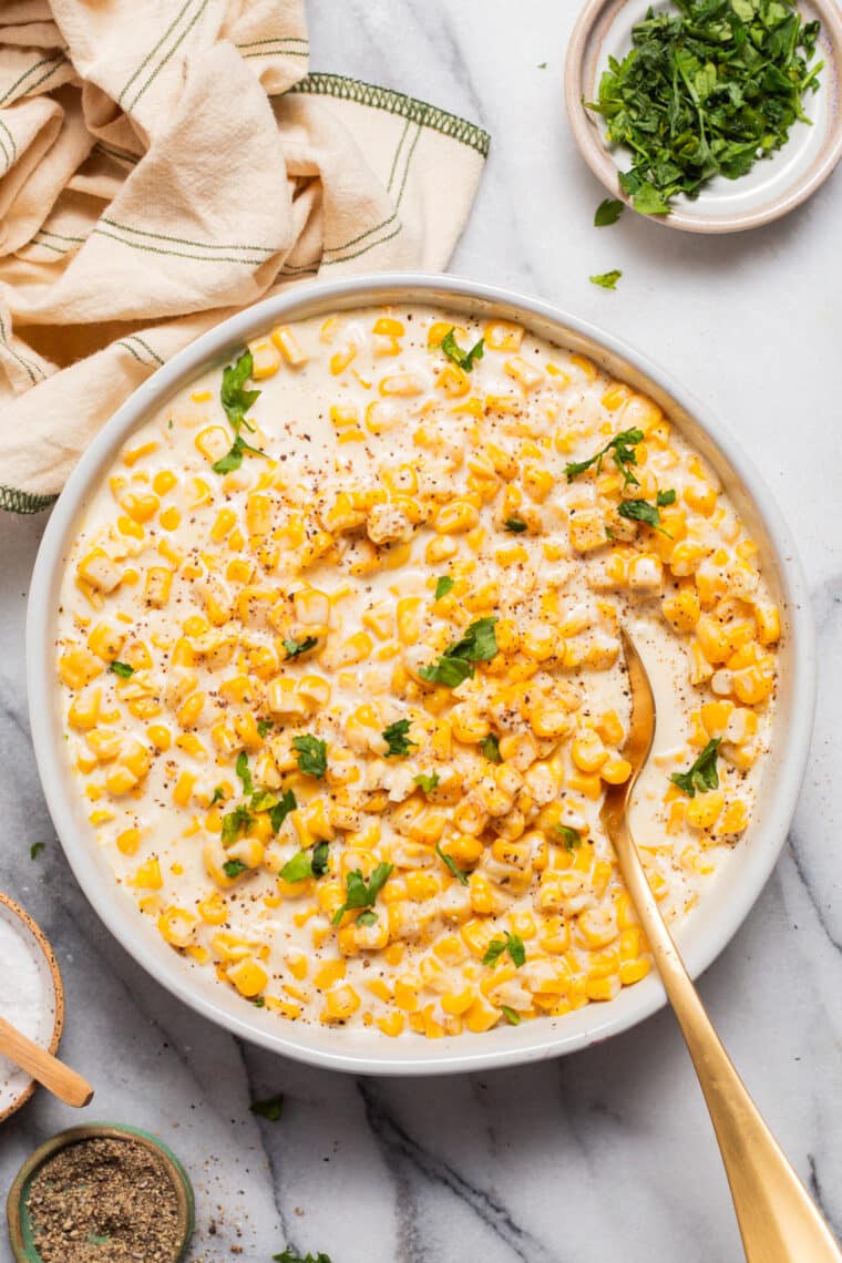 Slow Cooker Creamed Corn - The dreamiest creamed corn! So velvety and creamy, and unbelievably easy to make with just 5 ingredients. Simply set and forget. SO GOOD!