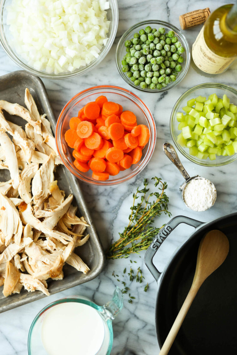 Biscuit Pot Pie - The ultimate comfort food! Topped with the flakiest, mile-high biscuits ever (made ahead of time). So cozy + so darn good!