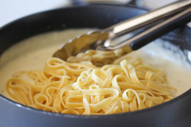 Skinny Fettuccine Alfredo - A rich and creamy lightened up alfredo sauce that tastes just as good as the original!