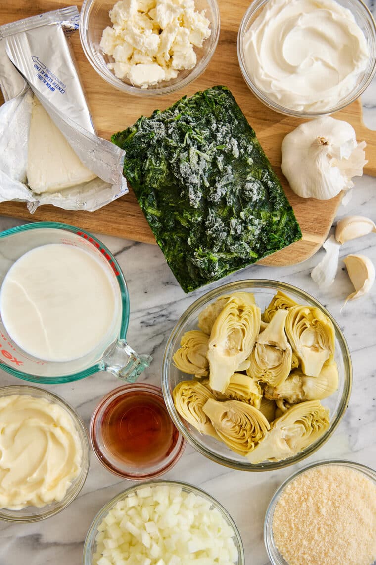 Slow Cooker Spinach and Artichoke Dip - Dump and go, set and forget right into the crockpot for the best and easiest cheesy, creamy dip ever!