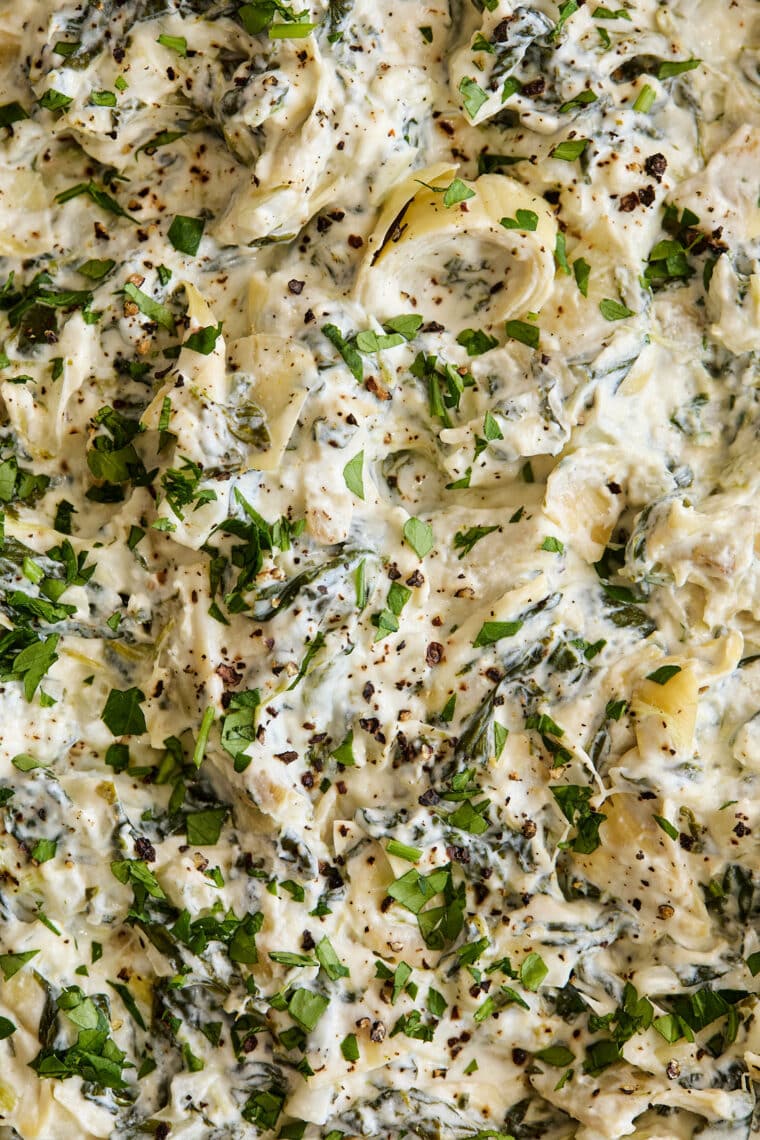 Slow Cooker Spinach and Artichoke Dip - Dump and go, set and forget right into the crockpot for the best and easiest cheesy, creamy dip ever!