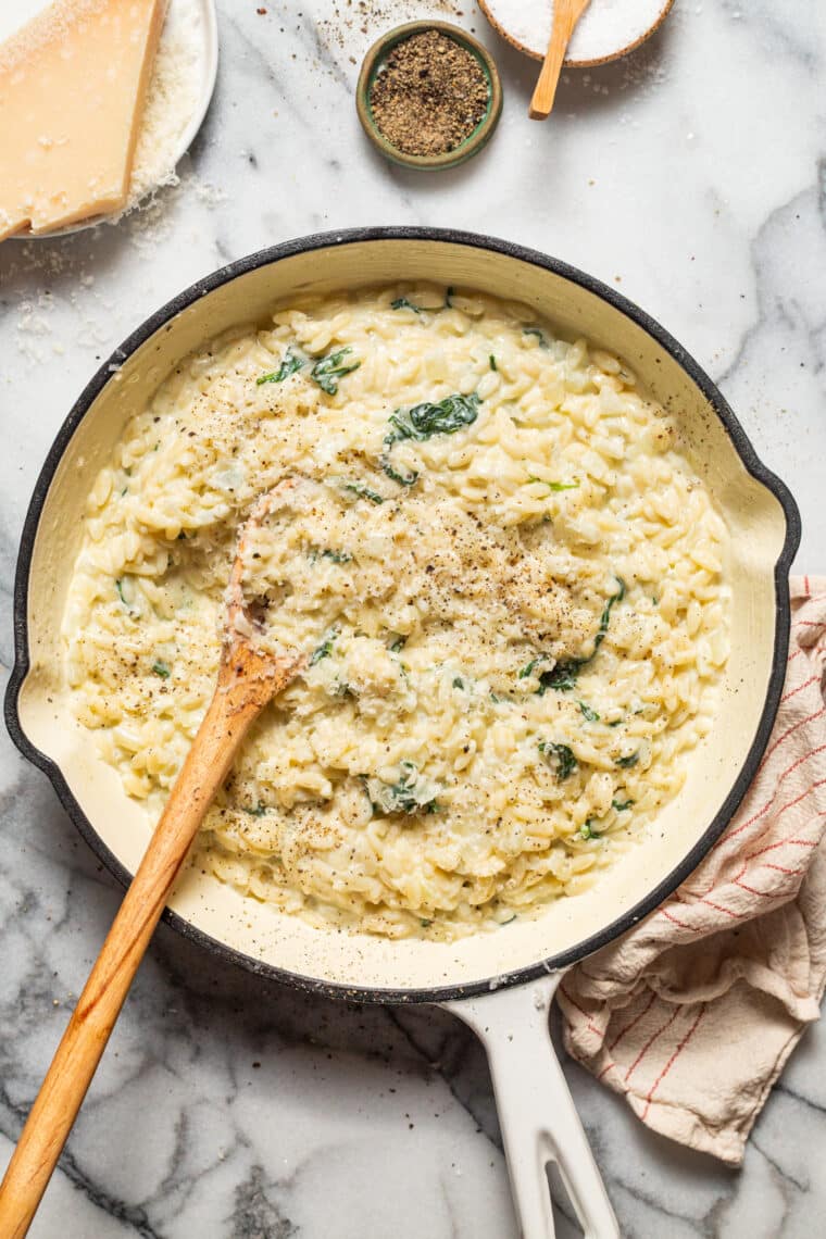 Parmesan and Spinach Orzo - This creamy, velvety orzo side dish is quick and easy + will go with any main dish! An absolute family-favorite.