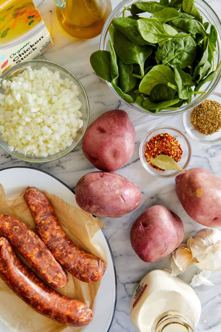 Sausage, Potato and Spinach Soup - Hearty, comforting, and done in 30 min. Made with crumbled sausage, tender potatoes and sneaked in greens!
