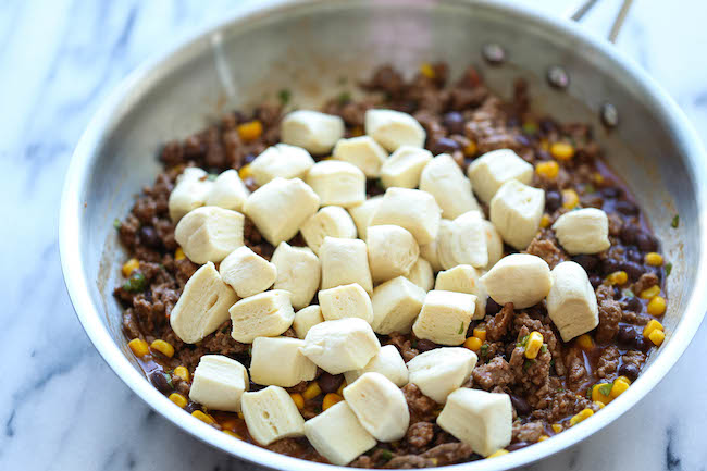 One Pan Enchilada Bake - The easiest and cheesiest enchilada bake made in a single pan - easy peasy with only one dirty pot. You can't beat that!