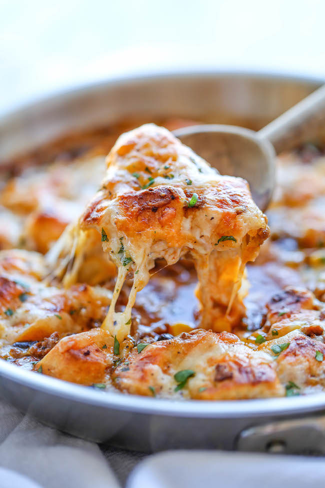 One Pan Enchilada Bake - The easiest and cheesiest enchilada bake made in a single pan - easy peasy with only one dirty pot. You can't beat that!