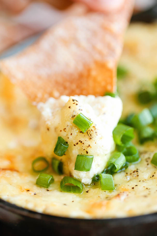 Crab Rangoon Dip - A take-out favorite made into the creamiest, cheesiest dip of all, served with the easiest homemade wonton chips!