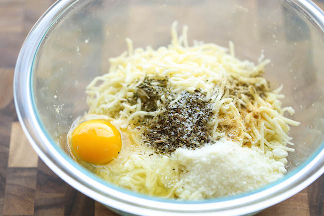 Mini Cauliflower Pizzas - These pizzas are made into easy single-serving portions and are so much healthier with a crisp cauliflower crust! 98.5 calories.