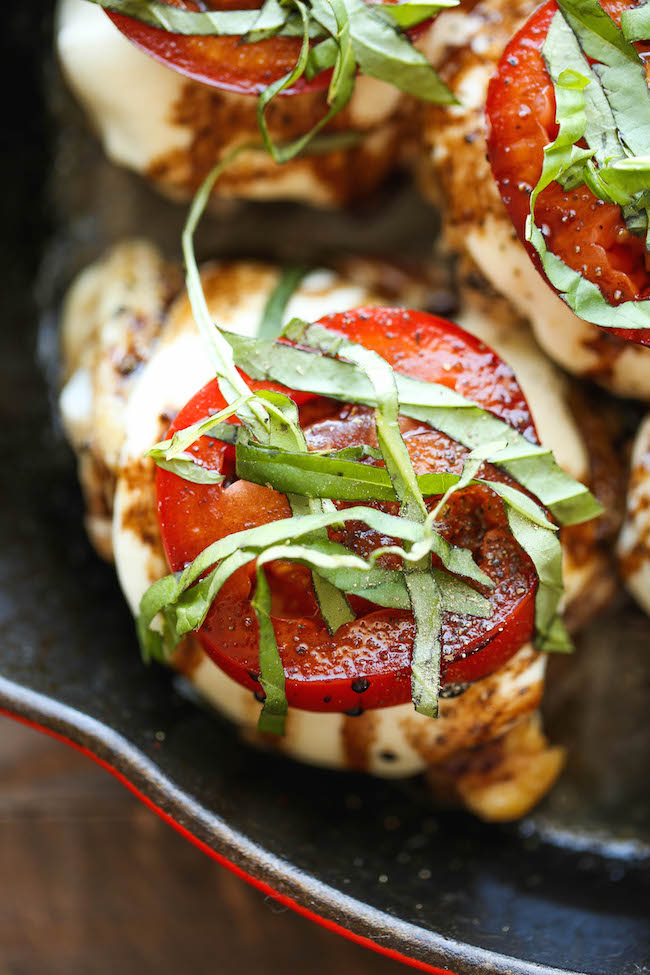 Baked Caprese Chicken - Amazingly crisp-tender chicken baked with melted mozzarella and topped with juicy tomatoes, fresh basil and balsamic reduction!