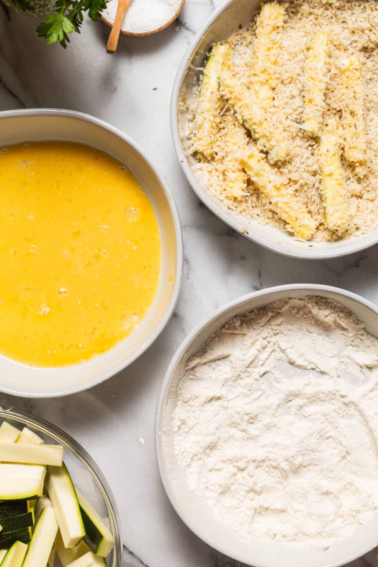 Baked Zucchini Fries - BAKED, super crispy, perfectly golden brown zucchini fries! So easy to make and such a healthier alternative to fries and chips. Yes, please!