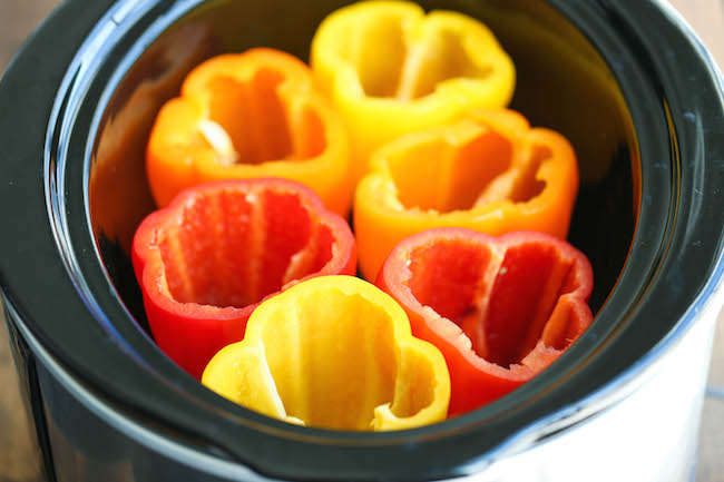 Slow Cooker Stuffed Peppers - Hearty, protein/fiber loaded peppers packed with so much flavor - and it's all made in the crockpot. Easy and effortless!