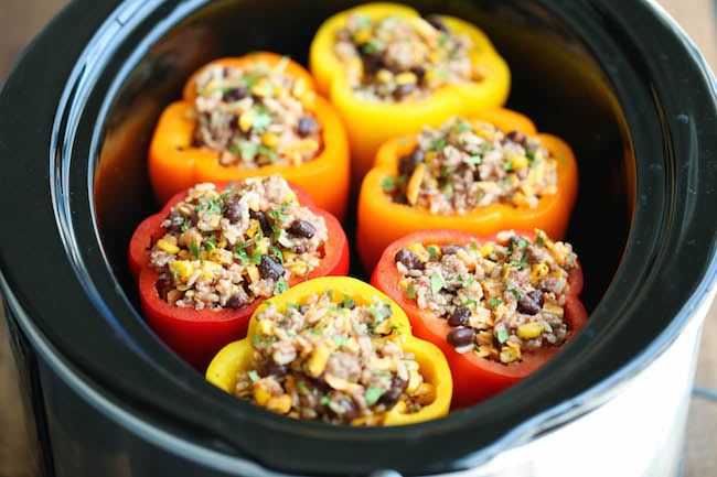 Slow Cooker Stuffed Peppers - Hearty, protein/fiber loaded peppers packed with so much flavor - and it's all made in the crockpot. Easy and effortless!