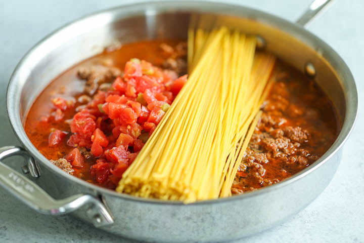 One Pot Taco Spaghetti - All your favorite flavors of tacos in spaghetti form - made in ONE PAN!  So cheesy, comforting and stinking easy with no clean-up!