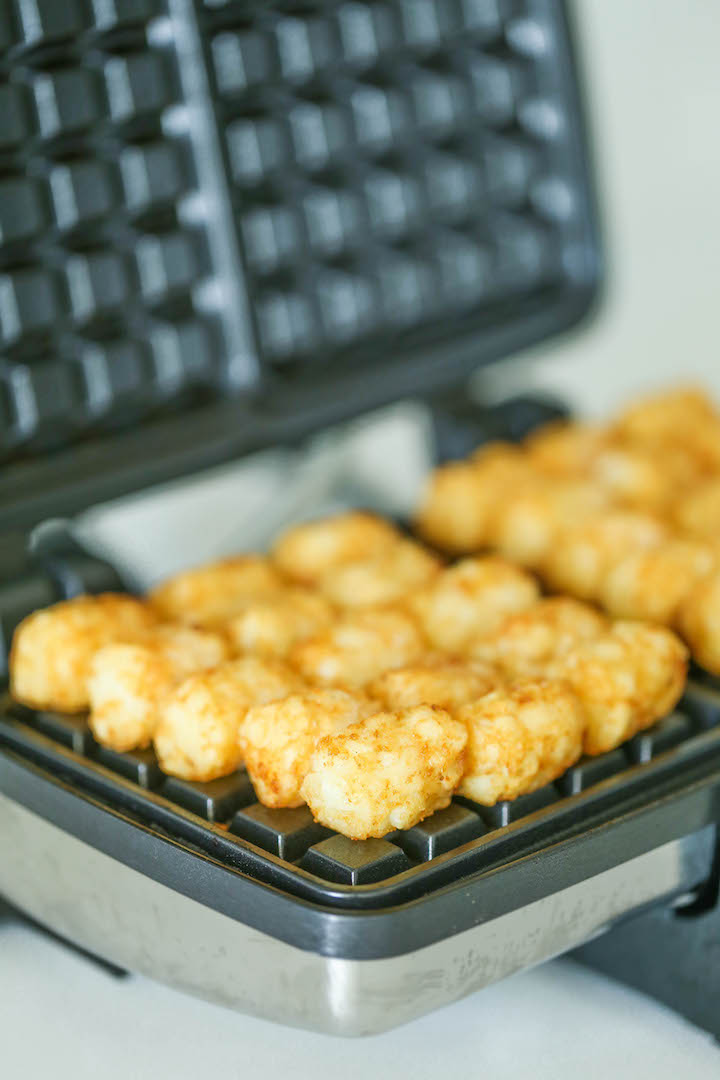 Tater Tot Waffles - Yes, you can turn tater tots into the BEST WAFFLES ever using a waffle iron! Seriously. Breakfast doesn't get any easier, or tastier!!
