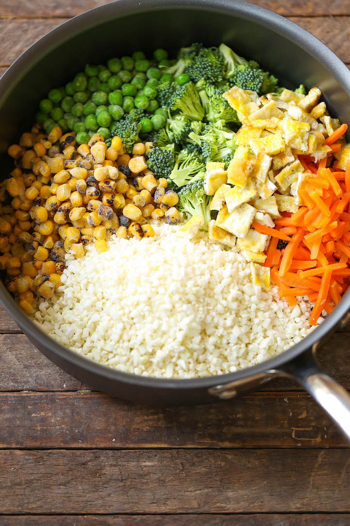 10 Minute Healthy Cauliflower Rice - An amazingly healthy twist on takeout fried rice but you can't even tell the difference. So EASY to make too!