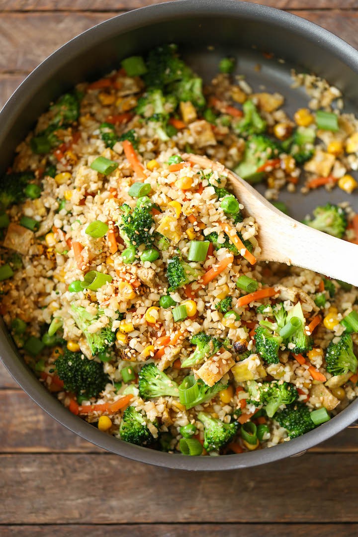 10 Minute Healthy Cauliflower Rice - An amazingly healthy twist on takeout fried rice but you can't even tell the difference. So EASY to make too!