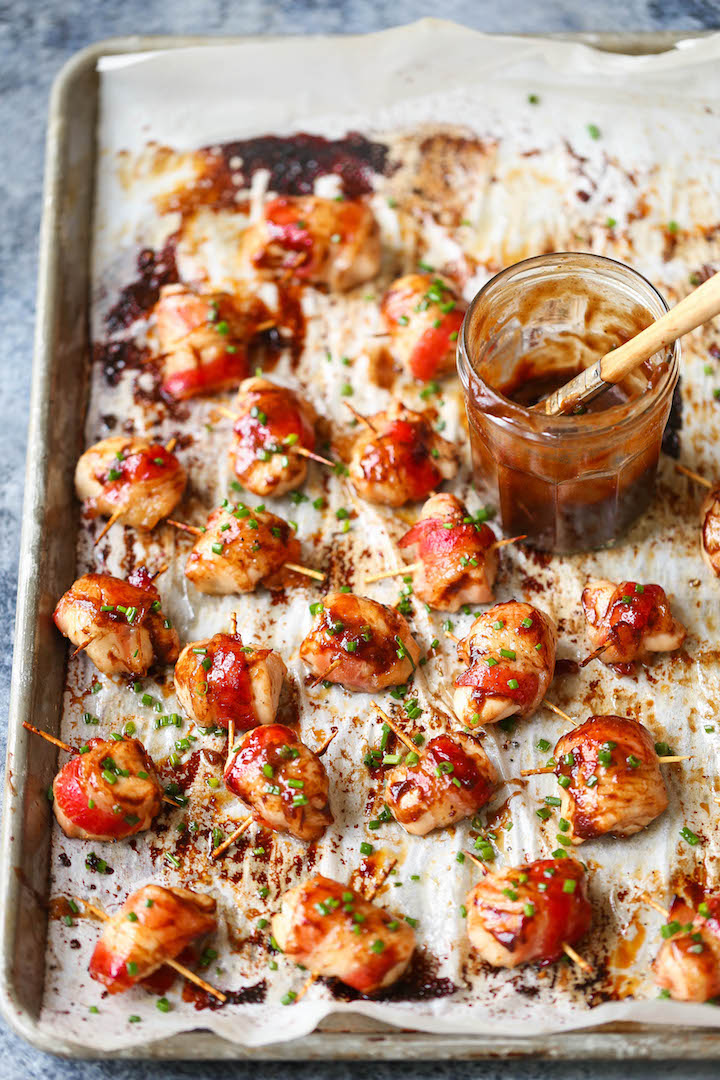 BBQ Chicken Bites - The best crowd-pleasing chicken bites wrapped in crisp-tender bacon and smothered in a smoky-sweet BBQ sauce!