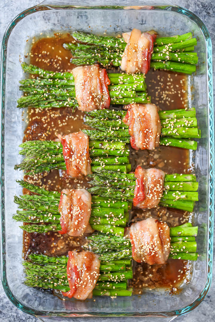 Bacon Wrapped Asparagus - Asparagus bundles wrapped in crisp-tender bacon in a buttery brown sugar glaze - grilled or baked! Can be prepped in advance!