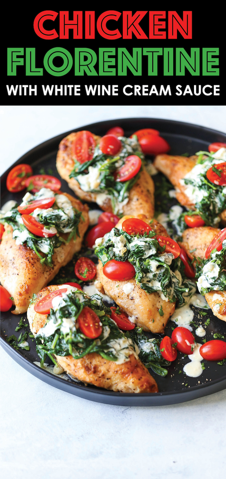 Chicken Florentine with White Wine Cream Sauce - Juicy chicken breasts topped with fresh spinach, tomatoes and a creamy white sauce that is AH-MAZING!