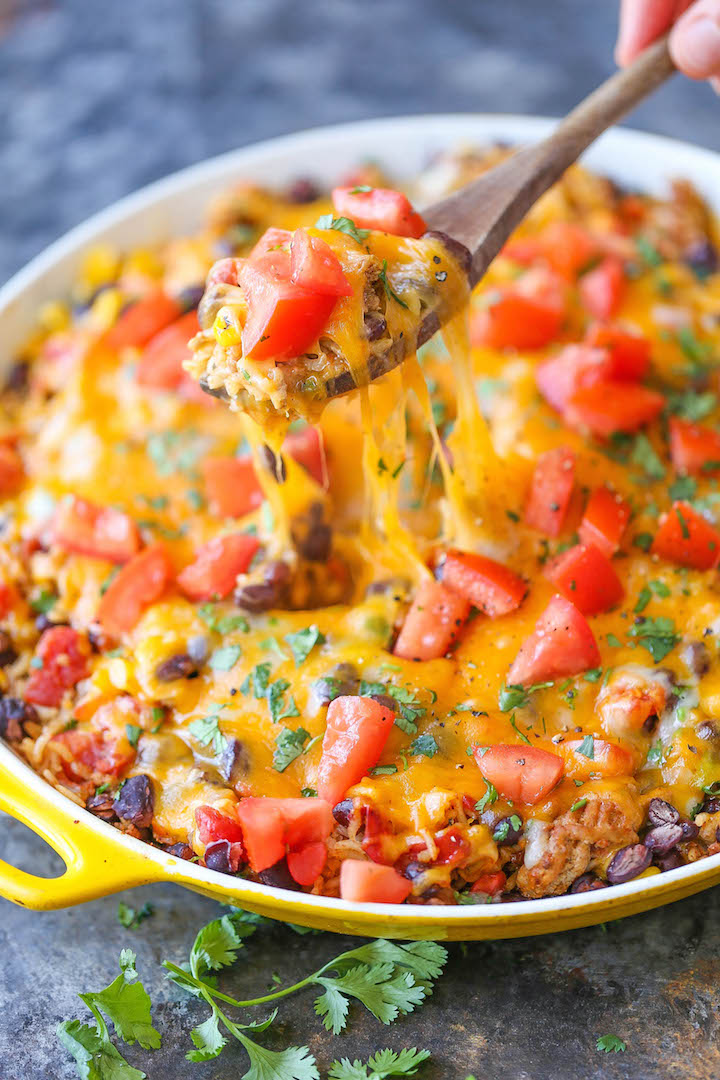 One Pot Mexican Beef and Rice Casserole - An easy peasy skillet dinner loaded with all that cheesy goodness. Even the rice gets cooked right in the pan!