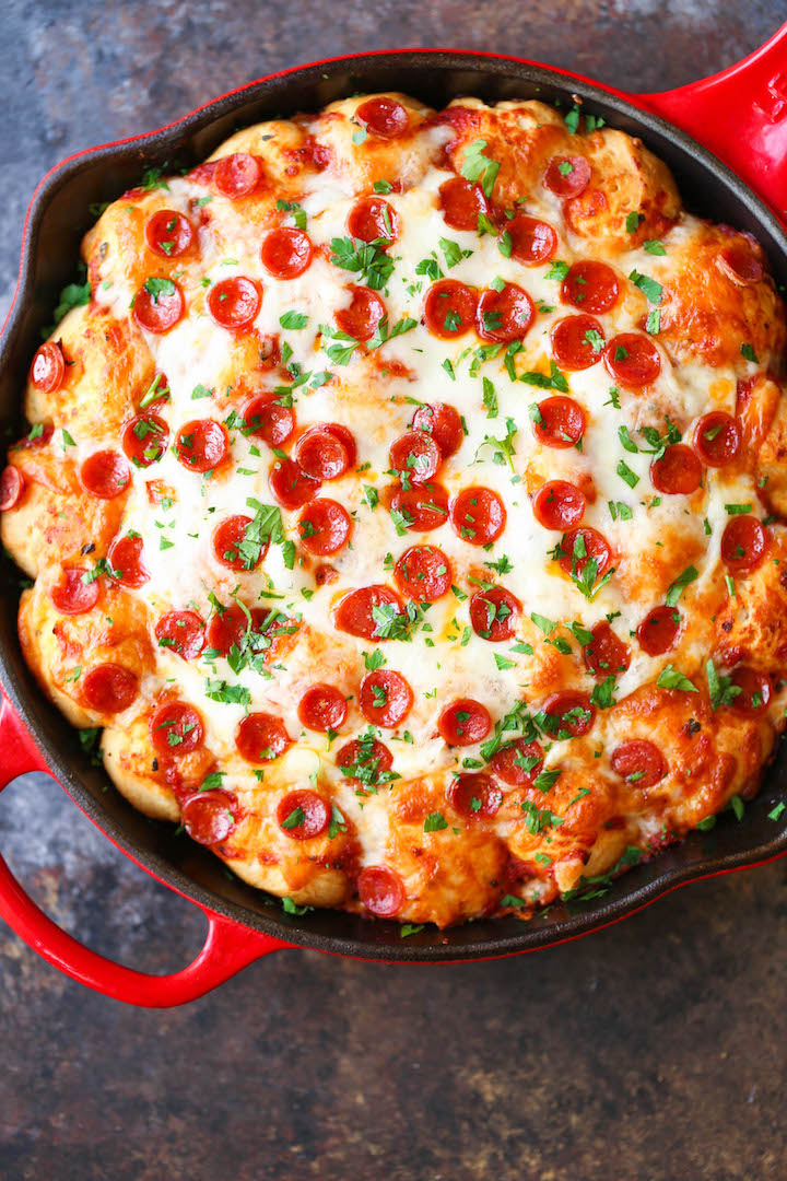 Cheesy Pizza Bread - The best and cheesiest pull apart bread ever! An easy addition to any menu or occasion. Except everyone will be fighting for a piece!