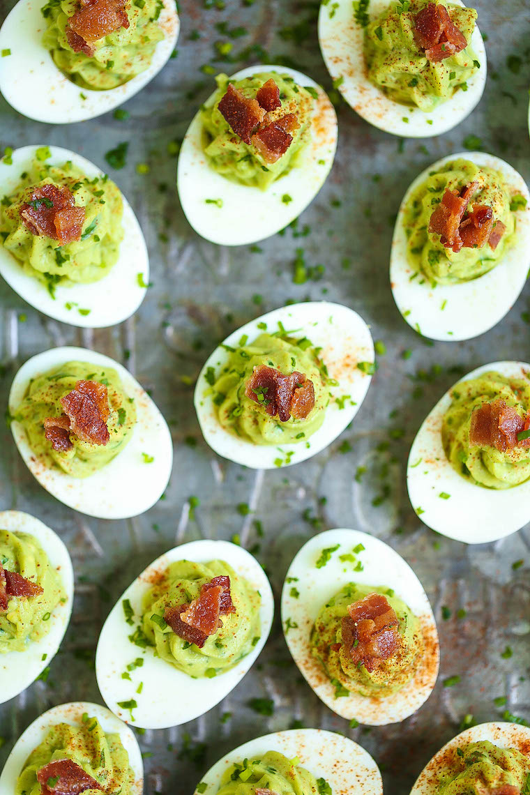 Avocado Deviled Eggs - A fun twist on classic deviled eggs! Loaded with creamy avocado and crispy bacon. Can be made up to 3 hours ahead!