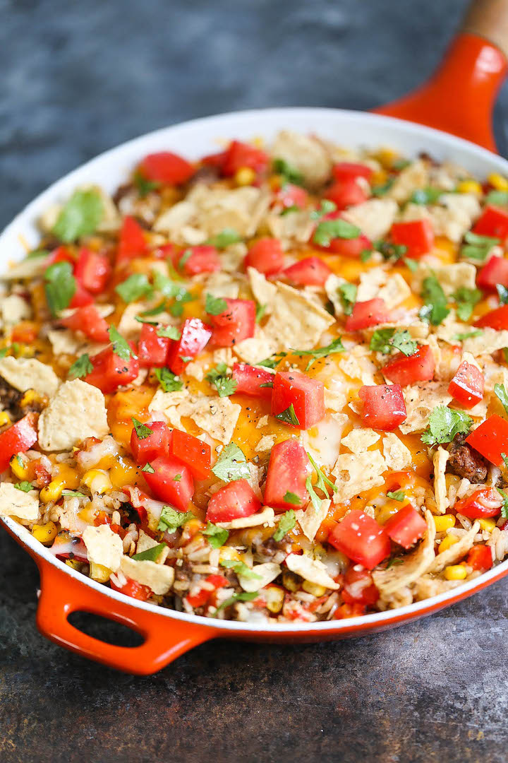One Pot Nacho Beef Skillet - A 30 minute ground beef skillet dinner where you only need to dirty up ONE PAN! With corn, tomatoes, bell peppers and cheese!
