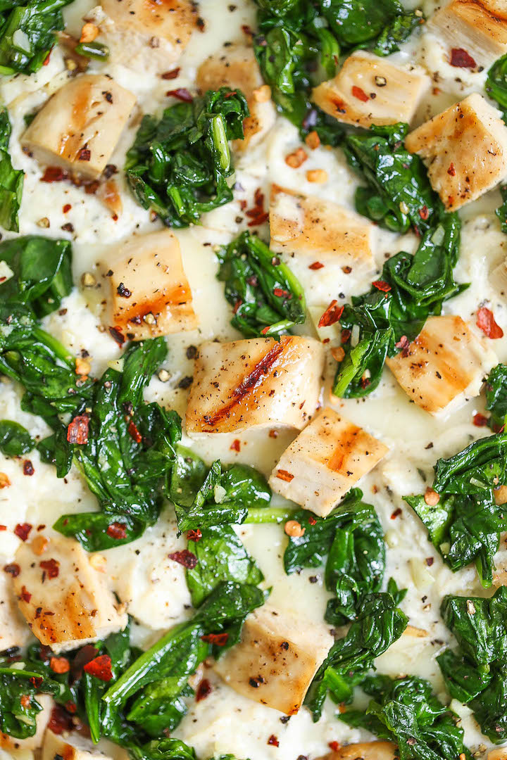 Roasted Garlic, Chicken and Spinach White Pizza - So amazingly cheesy with just the right amount of garlic. You can save the leftover garlic for later use!