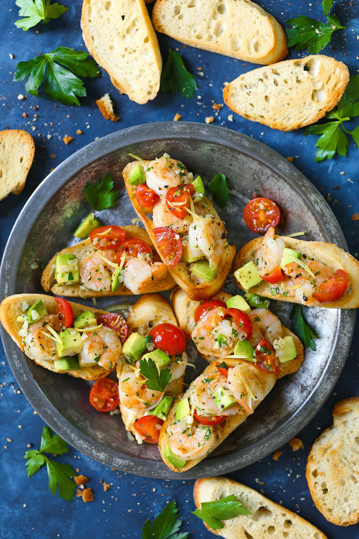 Garlic Shrimp and Avocado Crostini - The quickest and easiest appetizer you can whip up that is sure to be a crowd-pleaser! Everyone will beg for seconds!