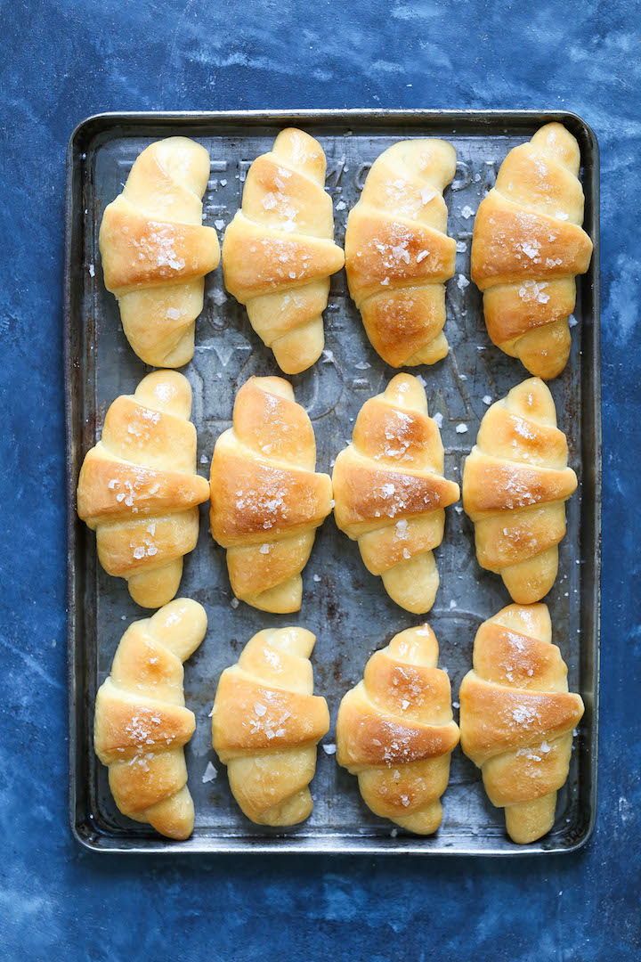 Homemade Crescent Rolls - No more store-bought crescent rolls! These can be made ahead of time, refrigerated or frozen. It's so easy, buttery and fluffy!