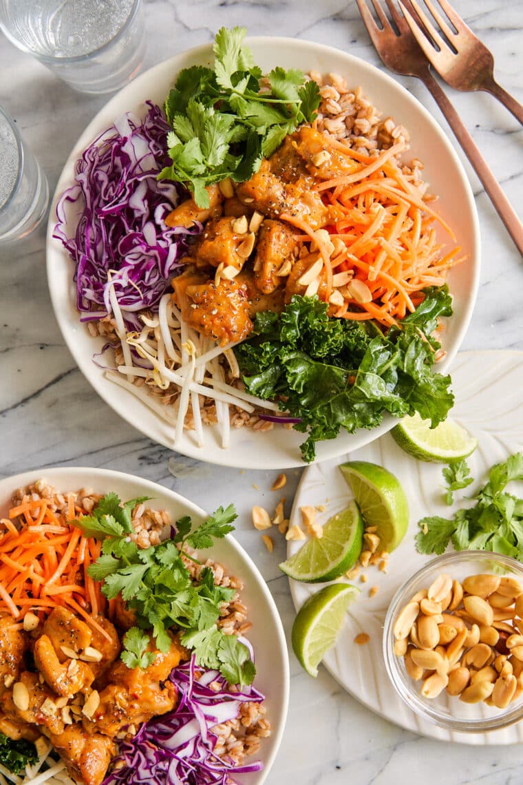 Thai Chicken Buddha Bowls - Packed with whole grains, fresh veggies, and a crave-worthy peanut sauce — so healthy, hearty and full of flavor!