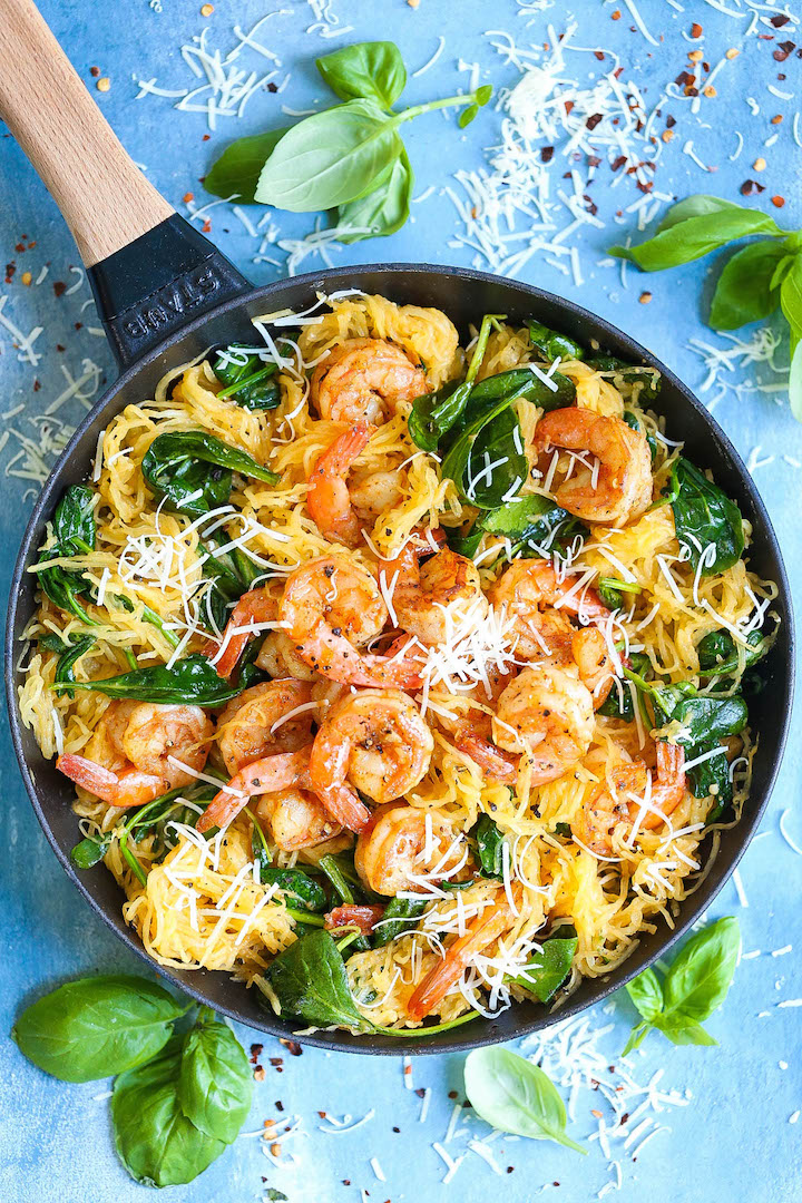 Shrimp Scampi Spaghetti Squash - Everyone's favorite shrimp scampi with a low-carb, healthier alternative to pasta using spaghetti squash! It's still amazingly buttery and garlicky with half the calories!