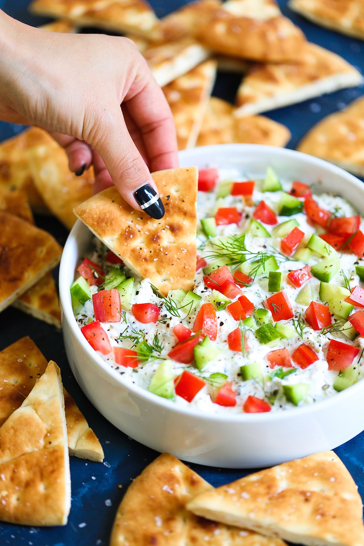 Creamy Greek Feta Dip - Such a simple yet creamy, satisfying dip that everyone will go crazy for! Takes just 15 minutes (or less) to whip up using feta, cream cheese, Greek yogurt, lemon juice and fresh herbs! You can even make this ahead of time and chill for up to 2 days! Serve with pita chips.
