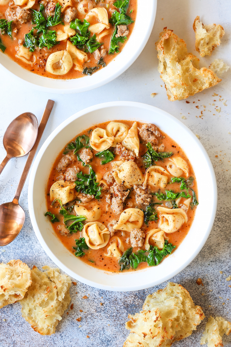 Creamy tortellini soup with Italian sausage, kale, and cheese tortellini served in a Dutch oven