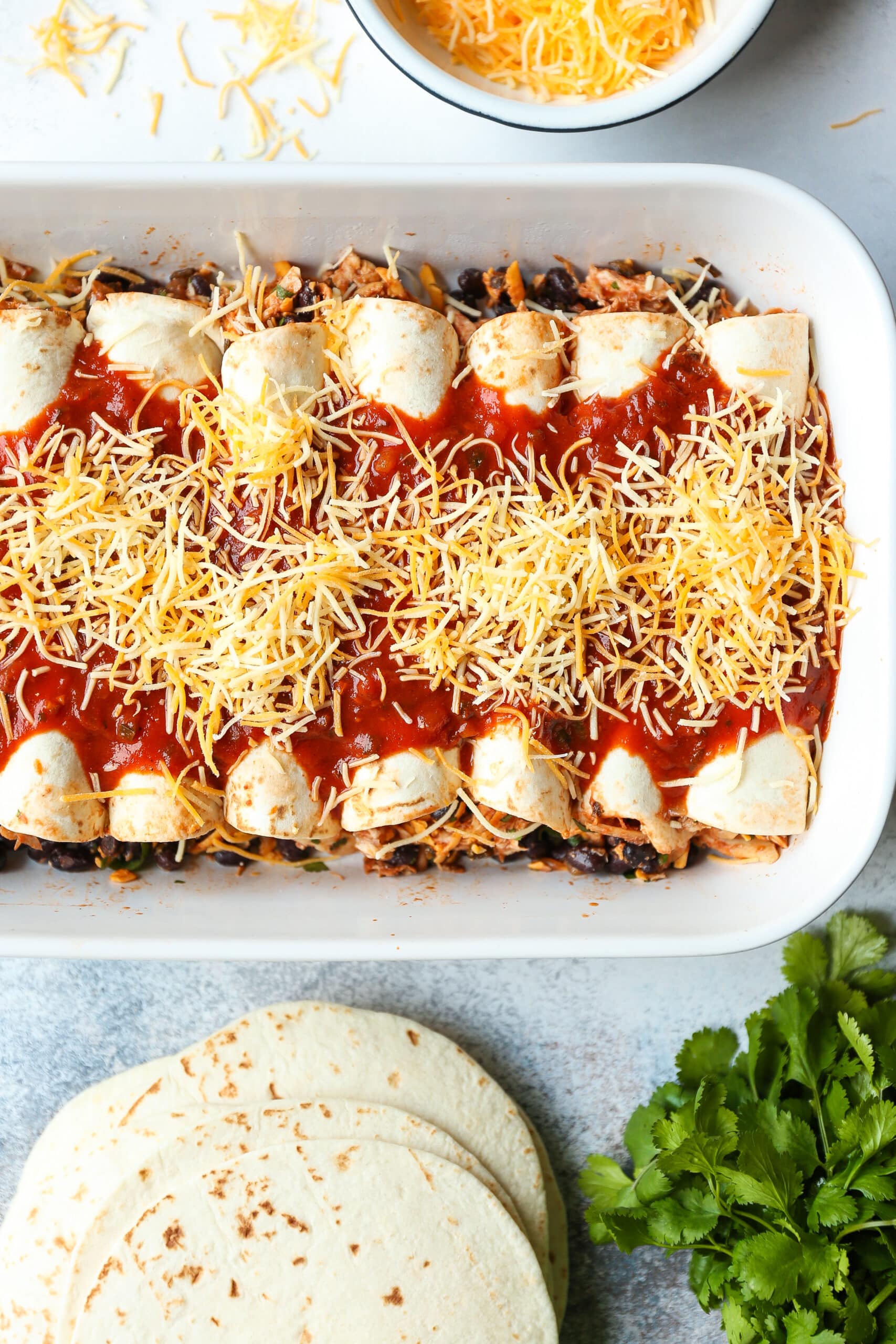 Weeknight Chicken Enchiladas - Classic chicken and black bean enchiladas! Easy to assemble with quick homemade enchilada sauce! Yes, please!